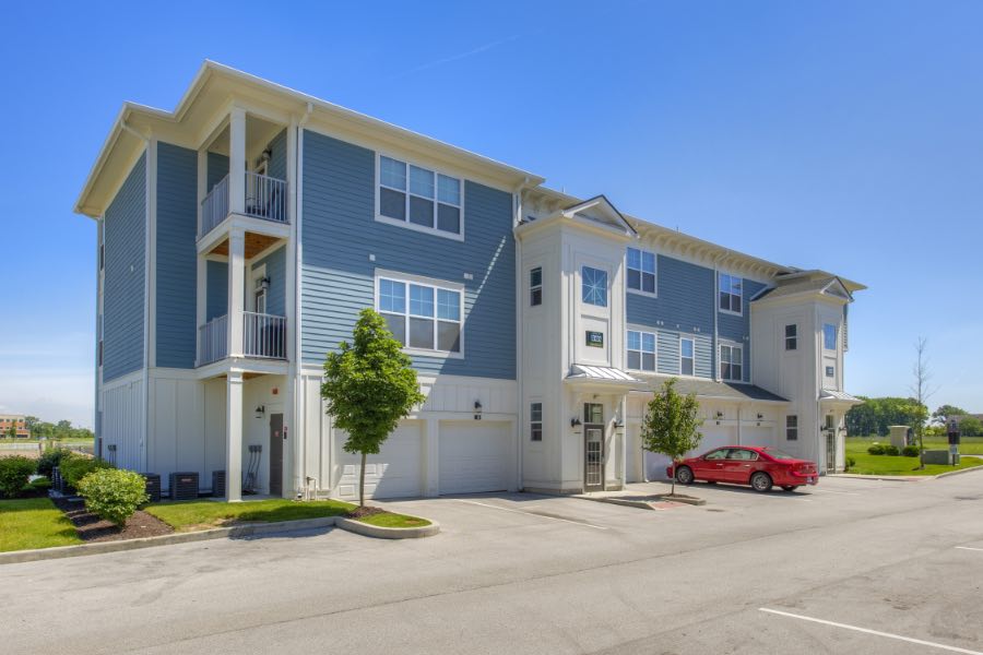 Attached garages like the ones seen here at The District at Saxony Apartment Homes offer incredible convenience. Apartment building with attached garages